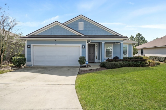 view of front facade with a garage and a front lawn