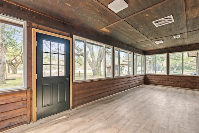 unfurnished sunroom with wooden ceiling and visible vents