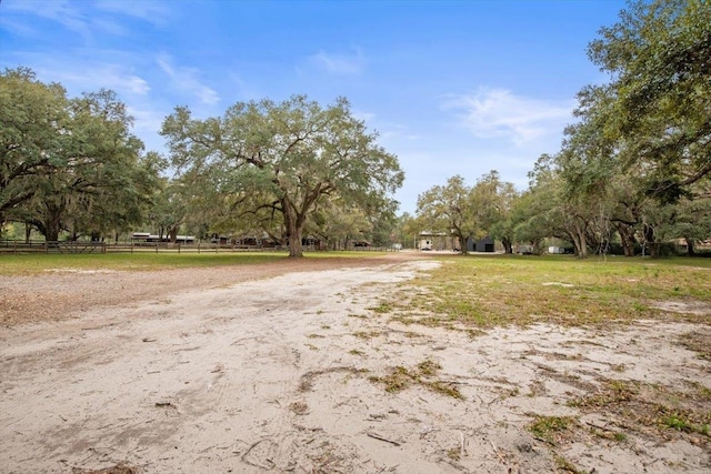 view of road with dirt driveway