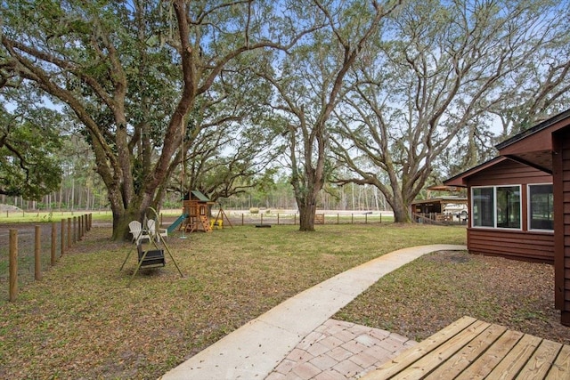 view of yard with fence and playground community