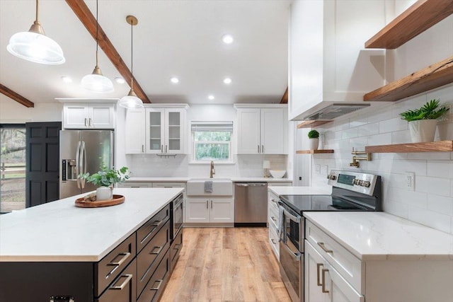 kitchen with open shelves, beamed ceiling, appliances with stainless steel finishes, and a sink