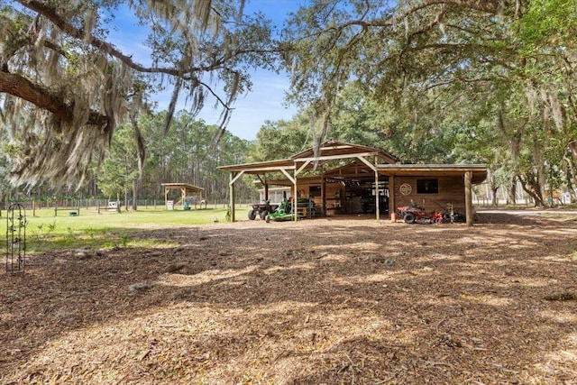 view of outbuilding with a carport