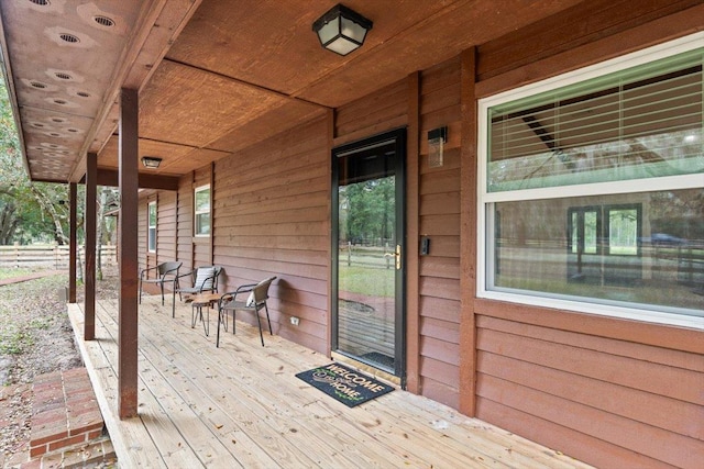 wooden terrace with a porch