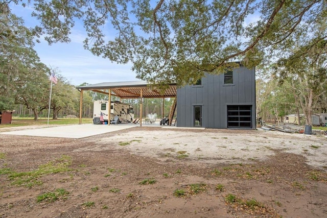 exterior space with an outbuilding and a carport