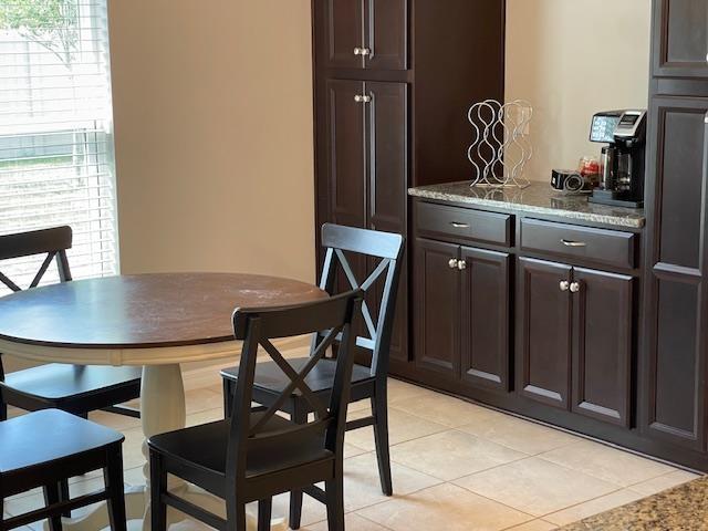 dining space with light tile patterned floors