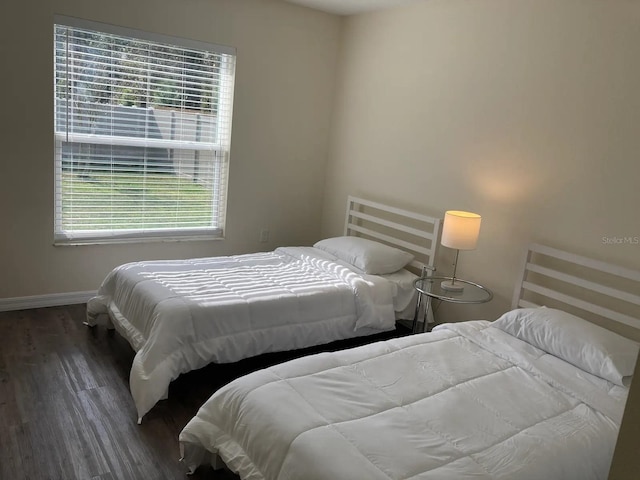 52 Fanshawe Ln, Palm Coast, FL 32137 - bedroom with wood finished floors and baseboards