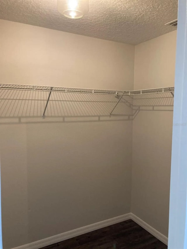 52 Fanshawe Ln, Palm Coast, FL 32137 - spacious closet featuring dark wood finished floors