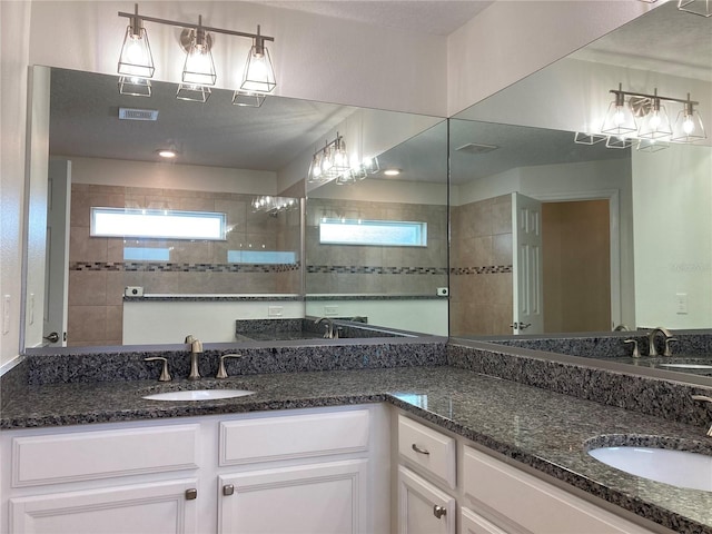 52 Fanshawe Ln, Palm Coast, FL 32137 - full bath with double vanity, healthy amount of natural light, and a walk in shower