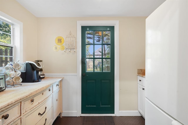 7 Cincinnati Ave, Saint Augustine, FL 32084 - entryway featuring a wainscoted wall and plenty of natural light