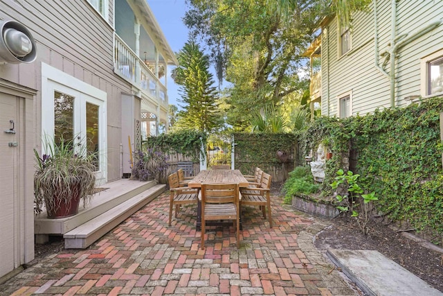 7 Cincinnati Ave, Saint Augustine, FL 32084 - fenced backyard featuring outdoor dining area, a patio, and french doors