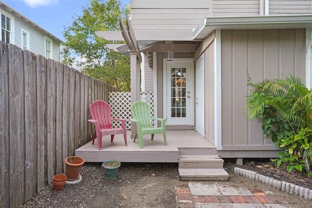 7 Cincinnati Ave, Saint Augustine, FL 32084 - doorway to property with board and batten siding and a wooden deck