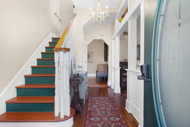 7 Cincinnati Ave, Saint Augustine, FL 32084 - entrance foyer featuring wood finished floors, a chandelier, and stairs