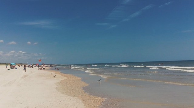 view of water feature with a beach view