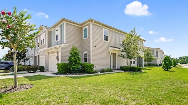 view of front of house featuring a front yard and a garage