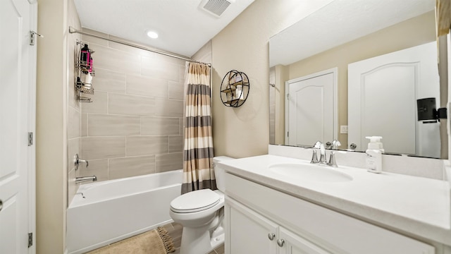 full bathroom with shower / tub combo, vanity, and toilet