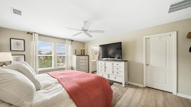 bedroom featuring light hardwood / wood-style floors and ceiling fan