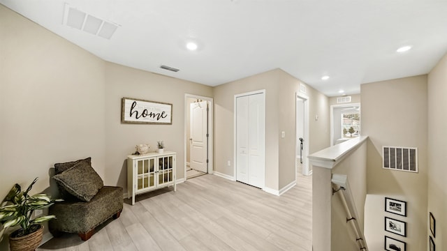 living area featuring light hardwood / wood-style floors