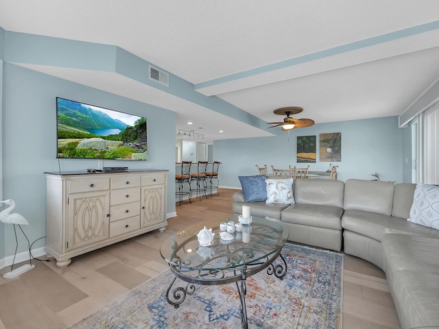 850 A1A Beach Blvd Unit 74, Saint Augustine Beach, FL 32080 - living area with a ceiling fan, light wood-style flooring, and beam ceiling