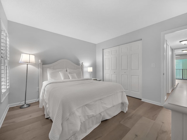 850 A1A Beach Blvd Unit 74, Saint Augustine Beach, FL 32080 - bedroom with wood finished floors, baseboards, and a closet