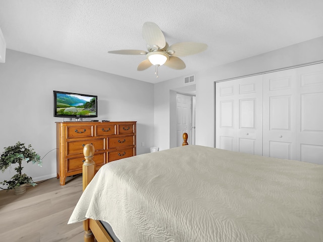 850 A1A Beach Blvd Unit 74, Saint Augustine Beach, FL 32080 - bedroom featuring light wood-type flooring, a textured ceiling, ceiling fan, and a closet