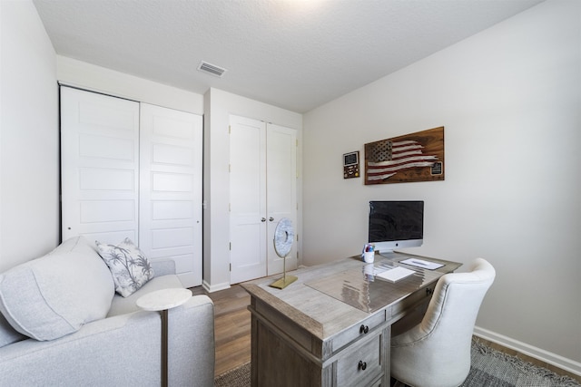 office area with dark hardwood / wood-style flooring