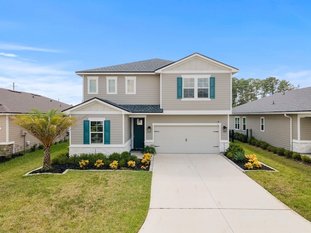 view of front of home with a garage and a front lawn