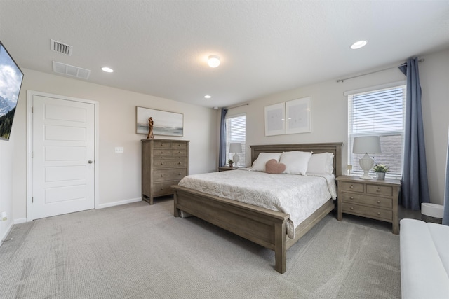 bedroom featuring light carpet