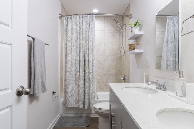 full bathroom with vanity, shower / bathtub combination with curtain, and toilet