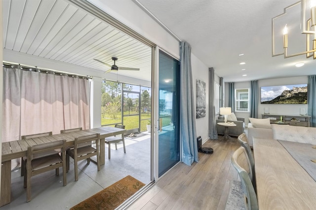 sunroom / solarium with ceiling fan