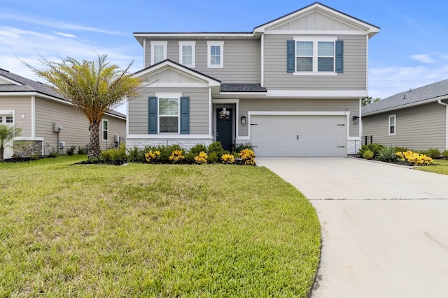 view of front facade with a garage and a front lawn