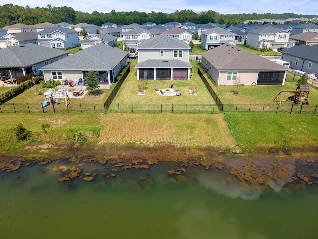 drone / aerial view with a water view