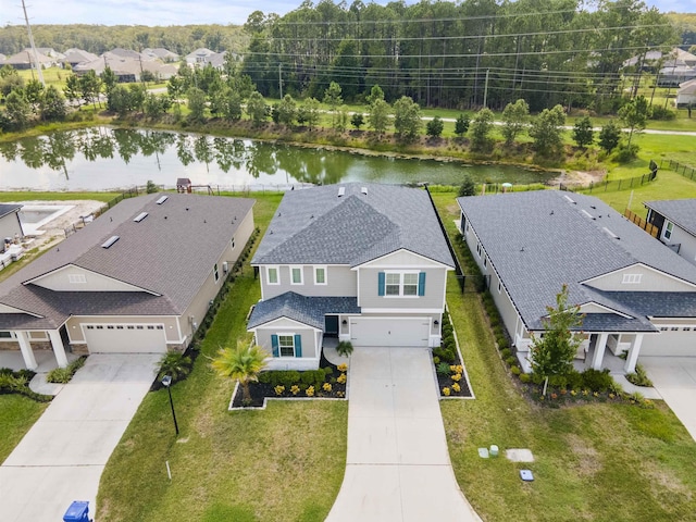 birds eye view of property with a water view