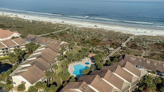 bird's eye view with a water view and a view of the beach