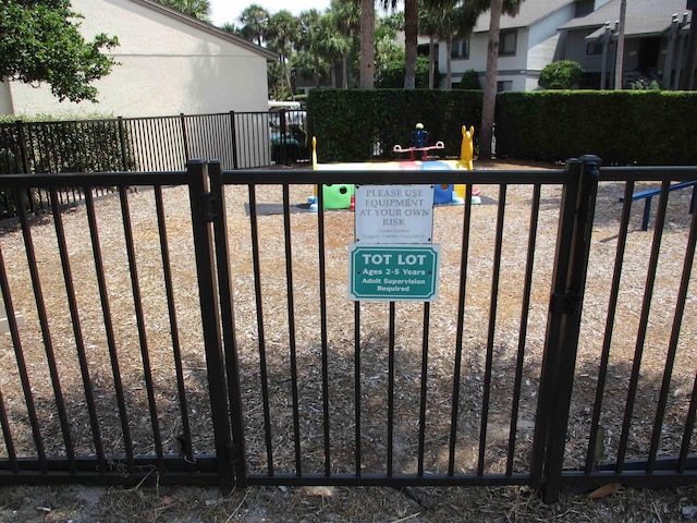 view of gate featuring fence