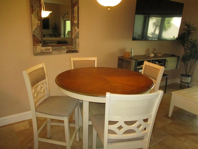 dining room featuring baseboards