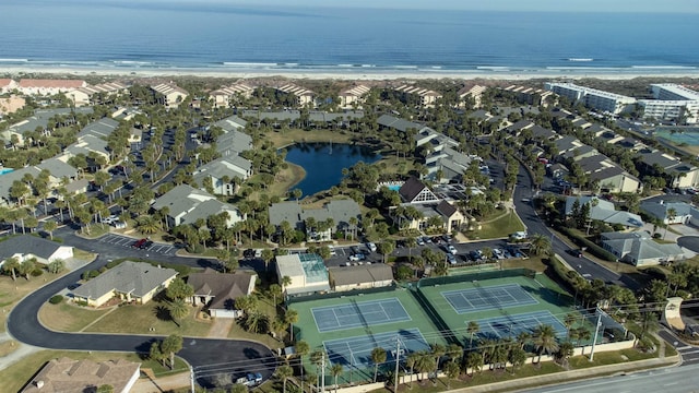 drone / aerial view with a water view and a residential view