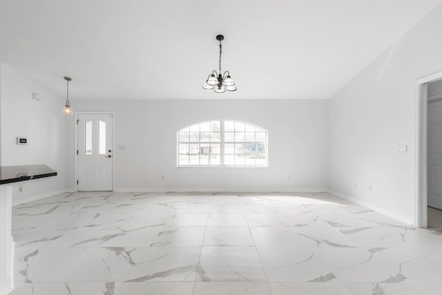 unfurnished dining area with baseboards, marble finish floor, vaulted ceiling, and an inviting chandelier