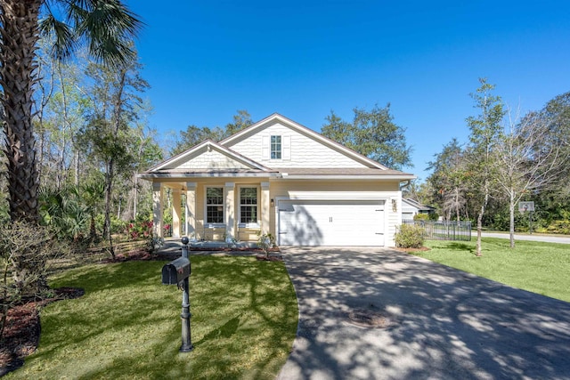 view of front facade featuring fence, driveway, an attached garage, covered porch, and a front lawn