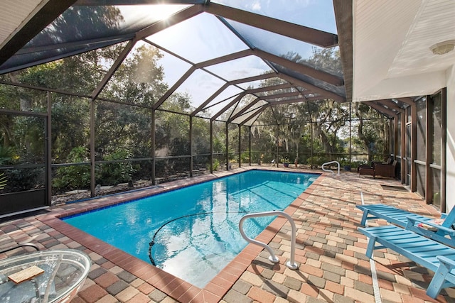 view of pool featuring a lanai and a patio area