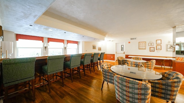 1 John Anderson Dr Unit 218, Ormond Beach, FL 32176 - dining area with hardwood / wood-style flooring and a dry bar