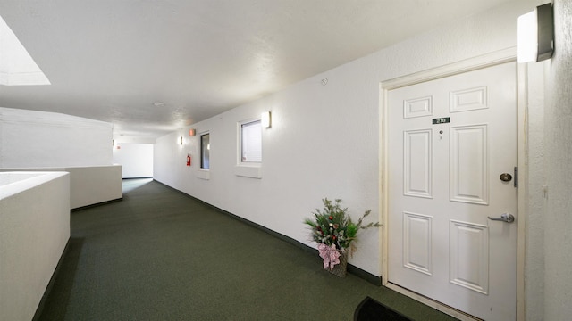 1 John Anderson Dr Unit 218, Ormond Beach, FL 32176 - corridor featuring dark colored carpet