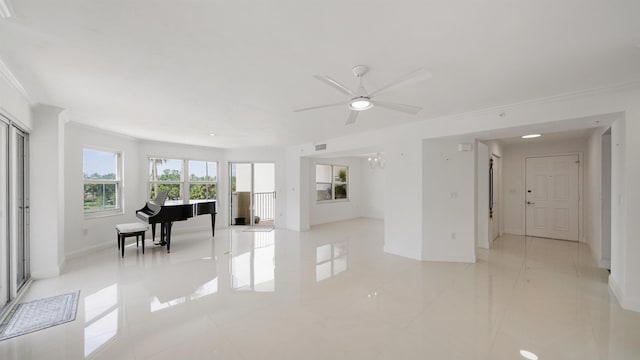 1 John Anderson Dr Unit 218, Ormond Beach, FL 32176 - living room with crown molding, baseboards, and a ceiling fan