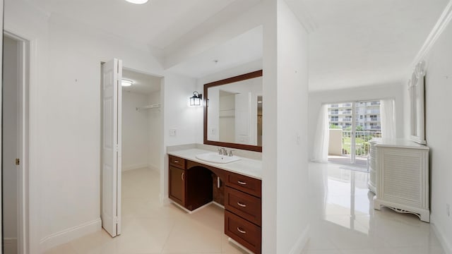 1 John Anderson Dr Unit 218, Ormond Beach, FL 32176 - bathroom featuring vanity, tile patterned flooring, baseboards, and ornamental molding