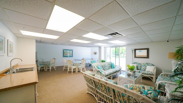 1 John Anderson Dr Unit 218, Ormond Beach, FL 32176 - living room with light colored carpet and a paneled ceiling