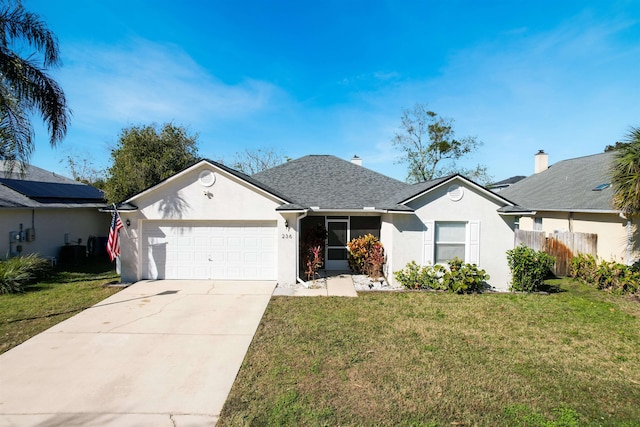 single story home with a front lawn and a garage