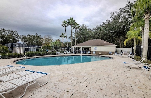 view of swimming pool featuring a patio area