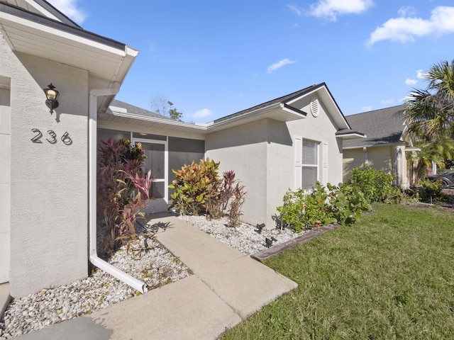 view of side of property featuring a yard