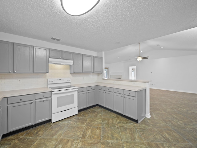 kitchen with kitchen peninsula, ceiling fan, gray cabinetry, white electric range oven, and vaulted ceiling