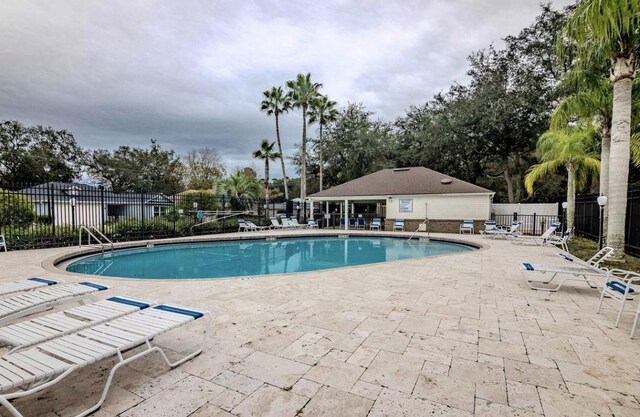 view of swimming pool with a patio