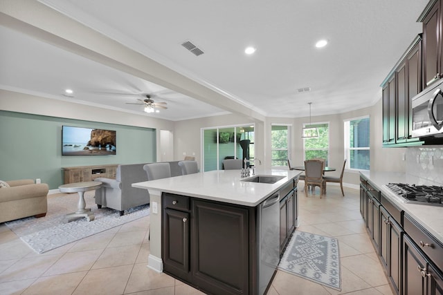 2790 Las Calinas Blvd, Saint Augustine, FL 32095 - kitchen with stainless steel appliances, open floor plan, a kitchen island with sink, light countertops, and recessed lighting